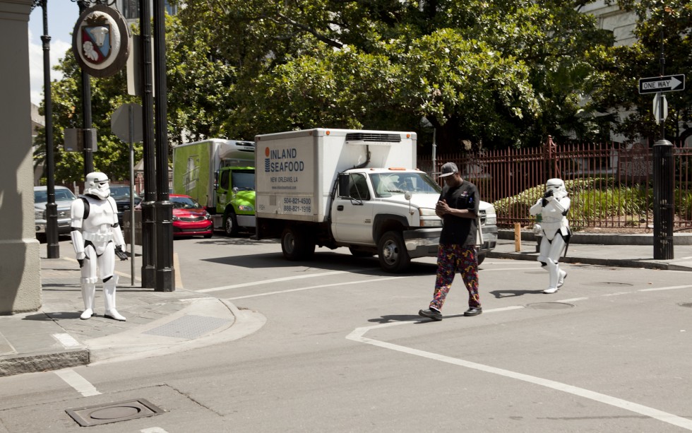 Storm Troopers shadow an oblivious man crossing a street